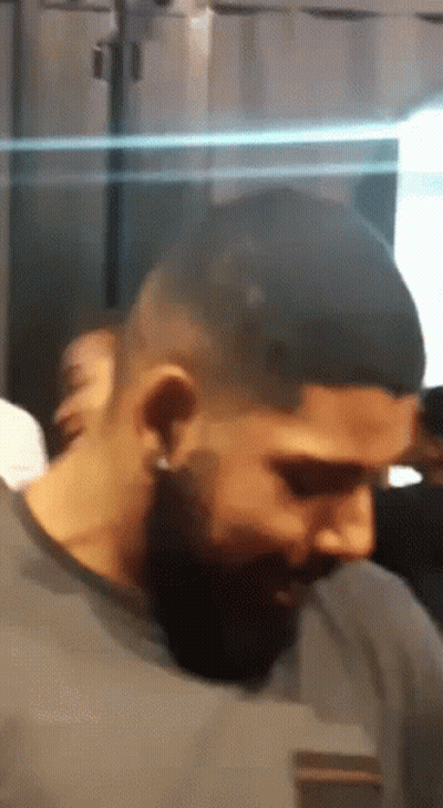 Close Up Of Bearded Man With Ear Piercings GIF