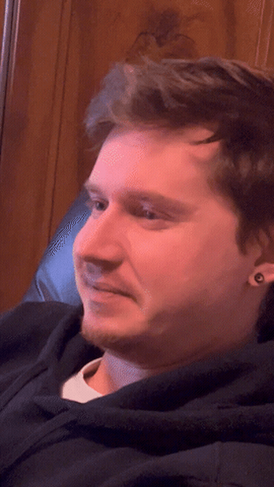 Close Up Of Bearded Man With Ear Piercings GIF