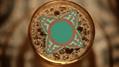 Close Up Of Beer Glass With Floral Design GIF