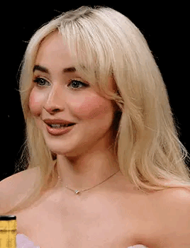 Close Up Of Blonde Woman Wearing Necklace And Strapless Dress GIF