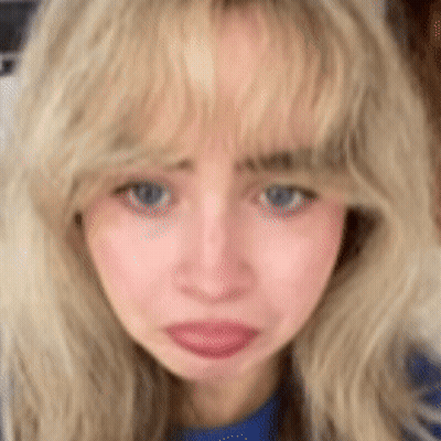 Close-Up Of Blonde Woman With Blue Eyes GIF