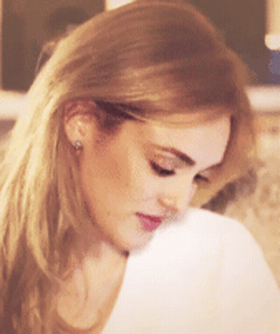 Close Up Of Blonde Woman With Earrings GIF