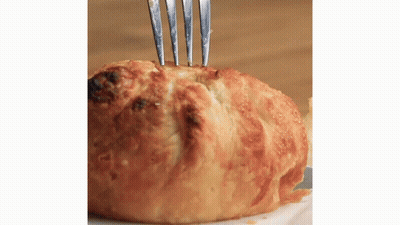 Close Up Of Bread With Fork GIF