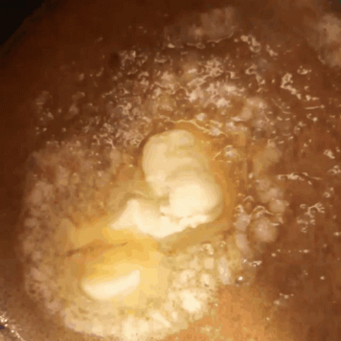 Close Up Of Brown Liquid With Bubbles GIF