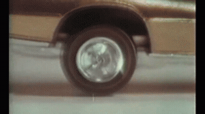 Close Up Of Car Wheel On Road GIF