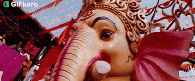 Close Up Of Crowned Deity Statue GIF