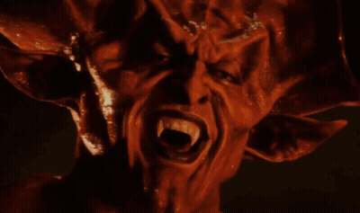 Close Up Of Devil Face With Fangs GIF