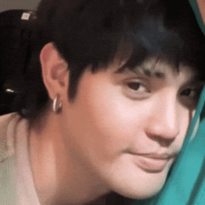 Close Up Of Face With Green Blanket GIF