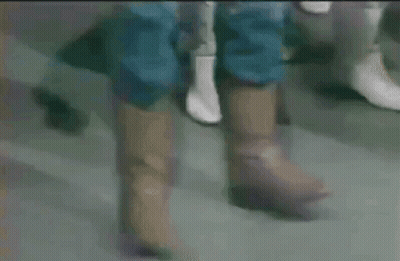 Close Up Of Feet In Brown Boots GIF
