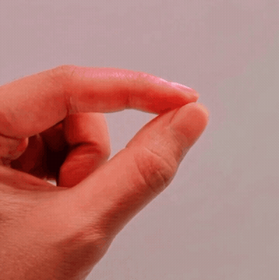 Close Up Of Finger With Pink Shimmer GIF