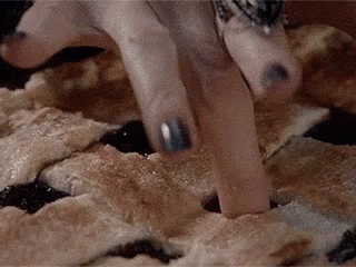 Close Up Of Fingers On Pie GIF