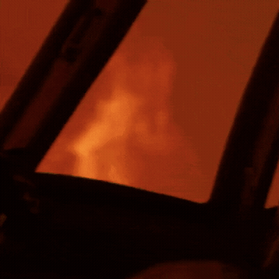 Close Up Of Fire Through Window GIF