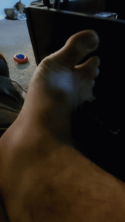 Close Up Of Foot With Red White Blue Object GIF