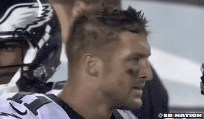 Close Up Of Football Player In Helmet And Jersey GIF