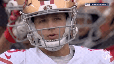 Close Up Of Football Player Wearing Helmet On Field GIF