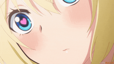 Close-Up Of Girl's Blue Eyes With Pink Heart GIF