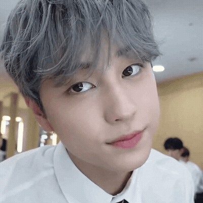 Close-Up Of Gray-Haired Person In White Shirt GIF
