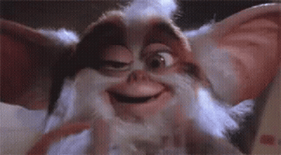 Close Up Of Gremlin Smiling With Eyes Closed GIF