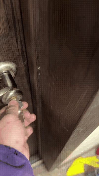 Close Up Of Hand Holding Door Handle GIF