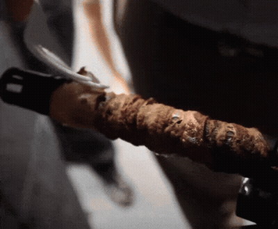 Close Up Of Hand Holding Sword GIF