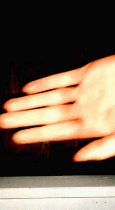 Close Up Of Hand On Dark Background GIF