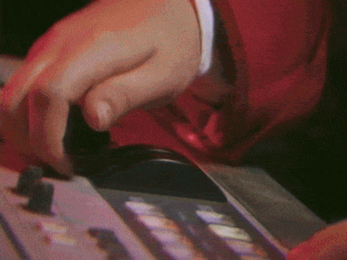 Close Up of Hand Playing Musical Instrument