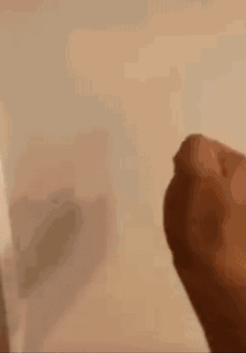 Close Up Of Hand With Shadow On Wall GIF