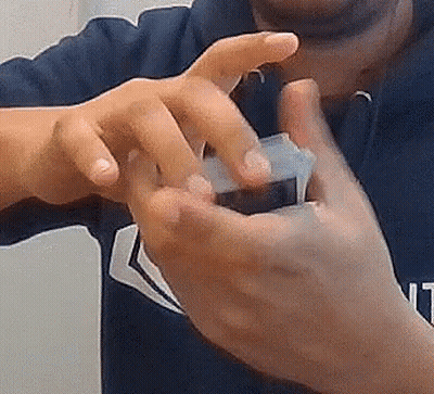 Close Up Of Hands Holding Small Object GIF