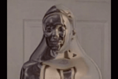 Close Up Of Hooded Woman Statue GIF