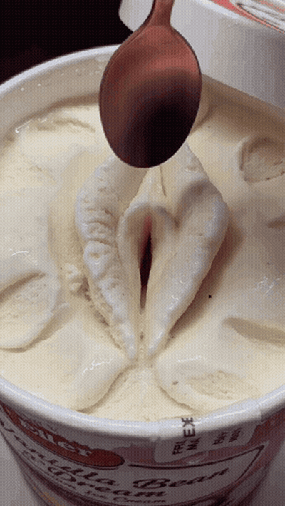 Close Up Of Ice Cream Container With Spoon GIF