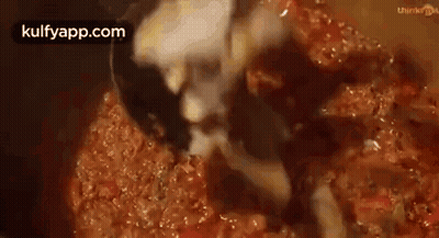Close-Up Of Ladle In Pot Of Sauce GIF