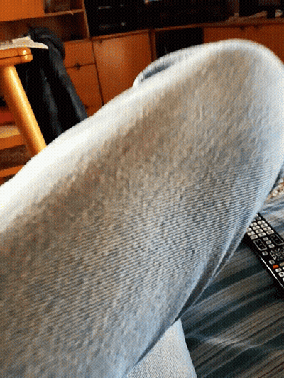 Close Up Of Leg With Remote Control GIF