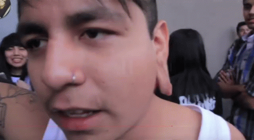 Close Up Of Man In Black Shirt Saying Punk GIF
