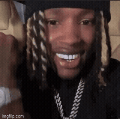Close Up Of Man In Hat And Necklace GIF