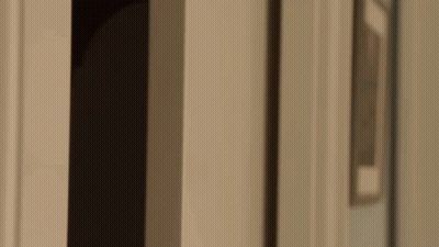 Close Up Of Man Looking Out Doorway GIF