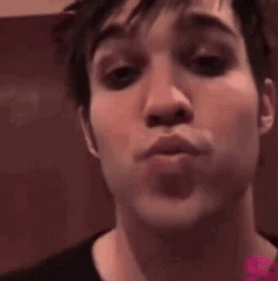 Close Up Of Man Making A Kiss GIF