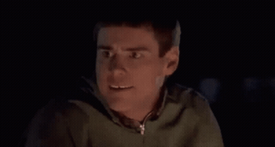 Close Up Of Man Making Funny Face In Dark Room GIF