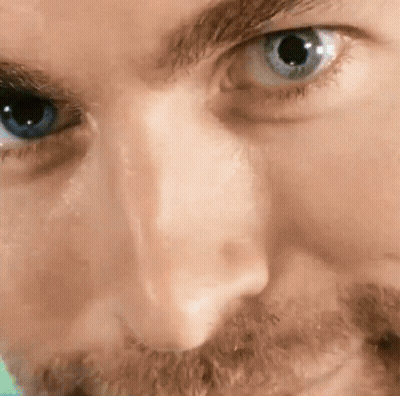 Close Up Of Man's Blue Eye With Beard GIF