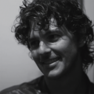 Close Up Of Man's Curly Hair Face GIF