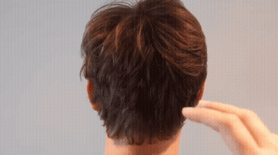 Close Up Of Man's Ear And Hand GIF