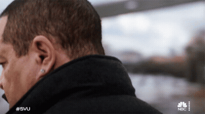 Close Up Of Man's Ear With NBC Logo GIF