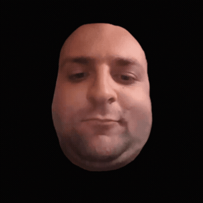 Close Up Of Man's Face Against Black Backdrop GIF