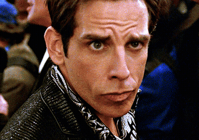 Close Up Of Man's Face In Black Jacket GIF