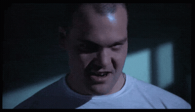 Close Up Of Man's Face In Dark Room GIF