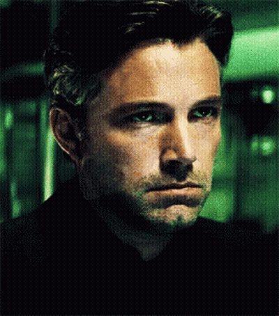 Close Up Of Man's Face In Dark Room GIF