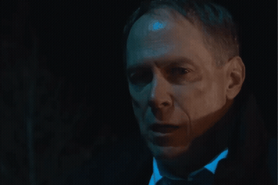Close Up Of Man's Face In Dark Room GIF