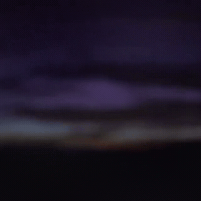 Close Up Of Man's Face In Darkness GIF