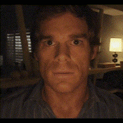 Close Up Of Man's Face In Front Of Lamp GIF