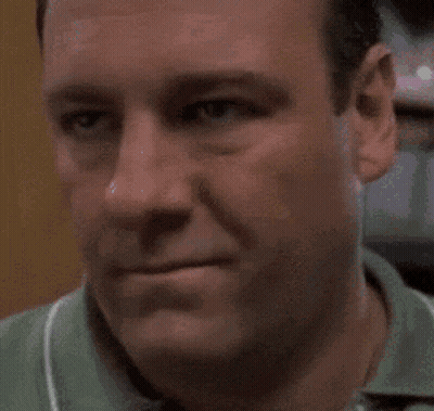 Close Up Of Man's Face In Green Shirt GIF