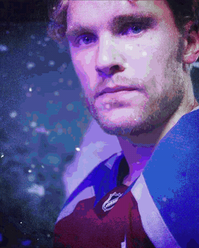 Close Up Of Man's Face In Purple And Blue Jersey GIF
